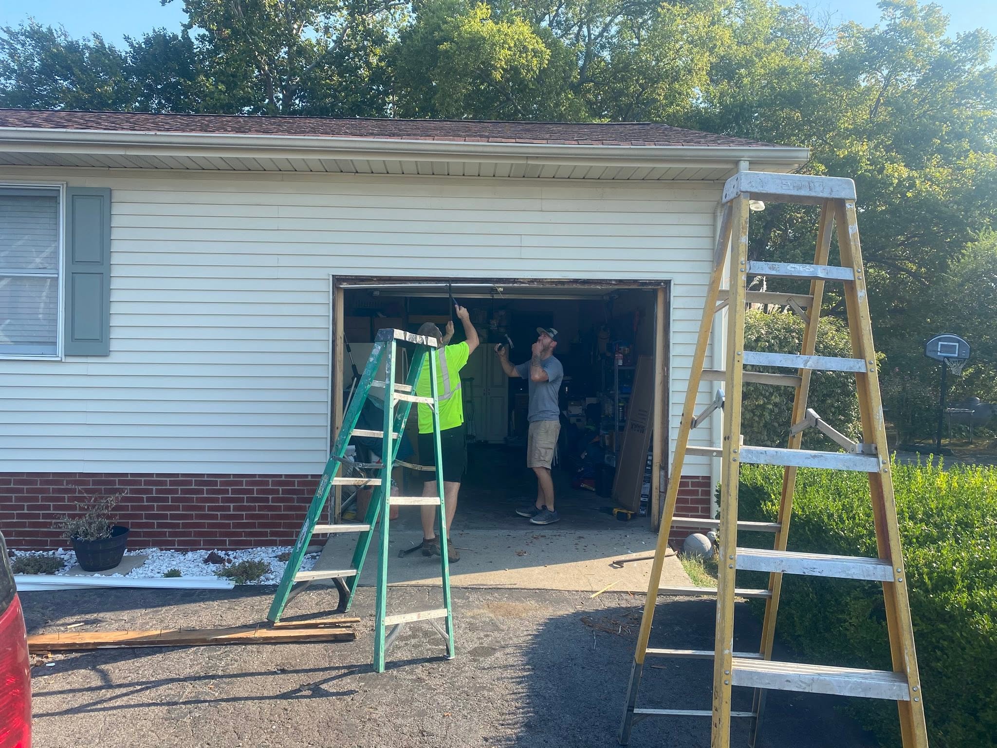 Gary's Home Improvement crew repairing a garage door in Springfield TN