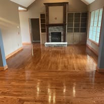 Refinished hardwood flooring in a living room